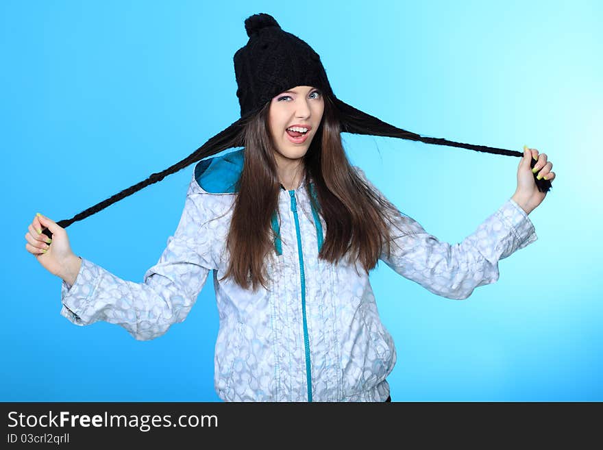 Happy girl teenager over blue background. Happy girl teenager over blue background.