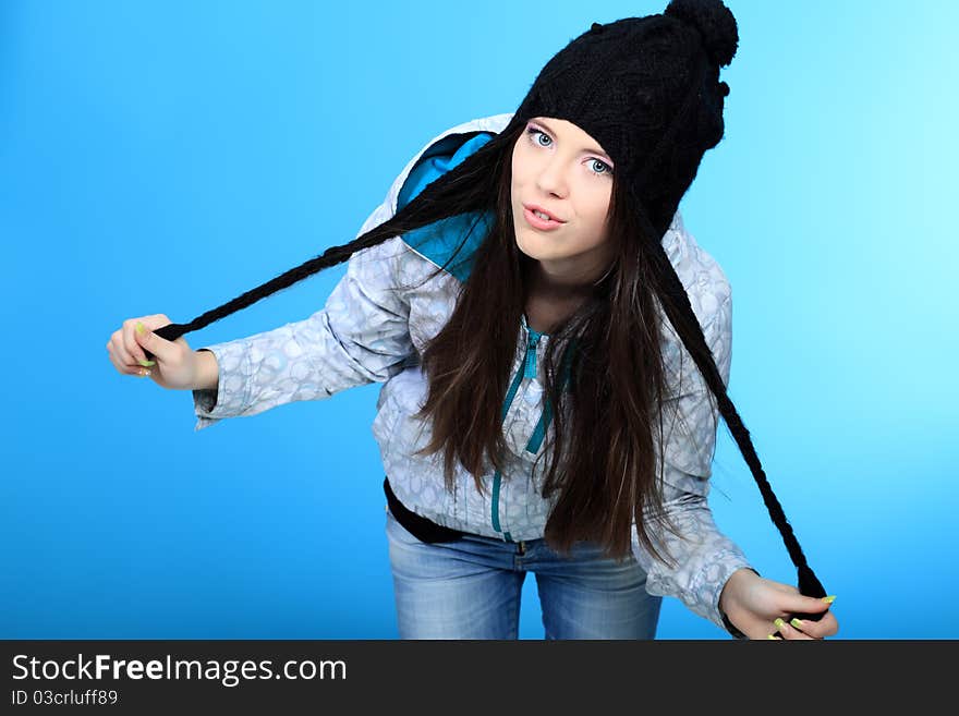 Happy girl teenager over blue background. Happy girl teenager over blue background.