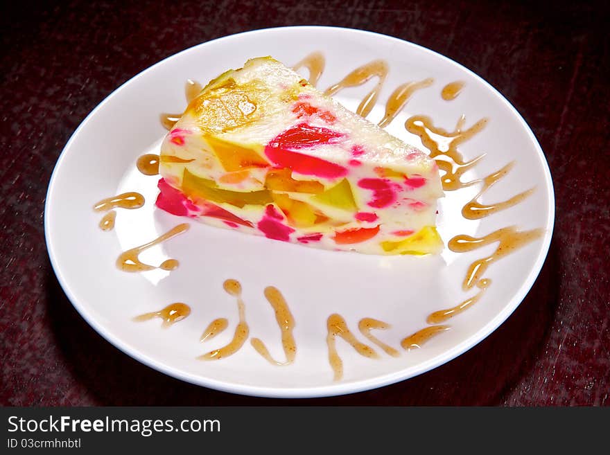 Appetizing slice of a pie with fruit.