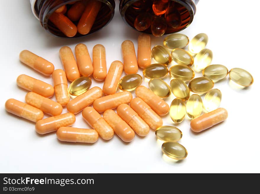 Medicine capsules scattered on a white background. Medicine capsules scattered on a white background