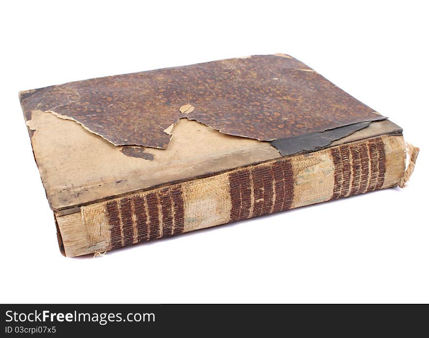 An old worn book with a ragged crust