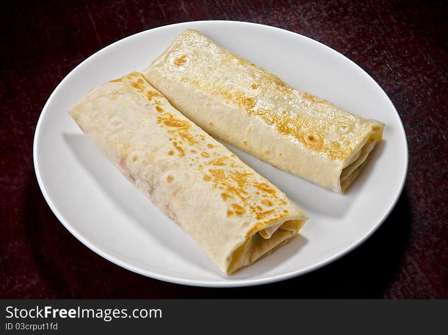 Pancakes with fried meat and vegetables: pepper, cabbage, parsley