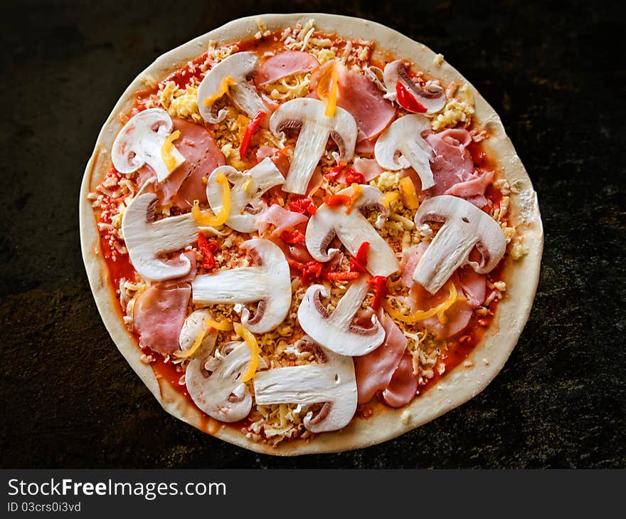 Appetizing pizza with mushrooms on a wooden tray