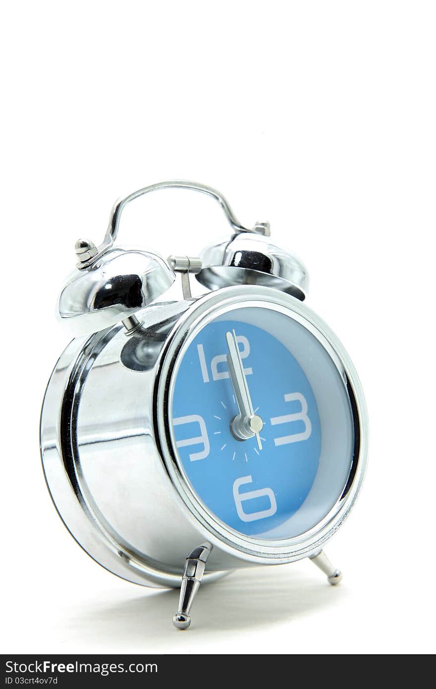 Isolated blue alarm clock on white side perspective