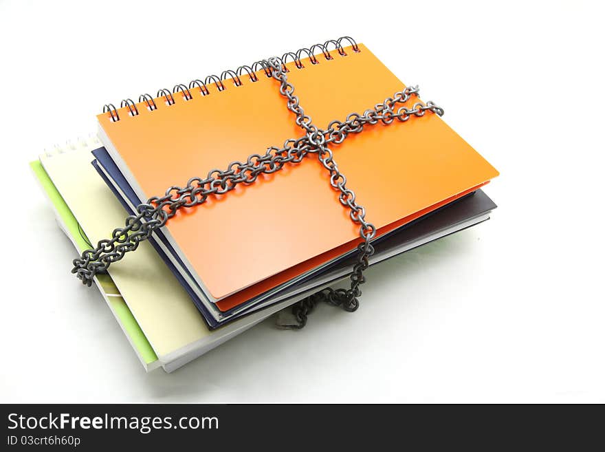 Stack of books with chain