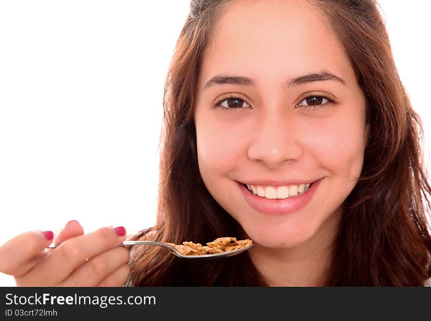 Happy women with a spoon in your hand with cereal. Happy women with a spoon in your hand with cereal