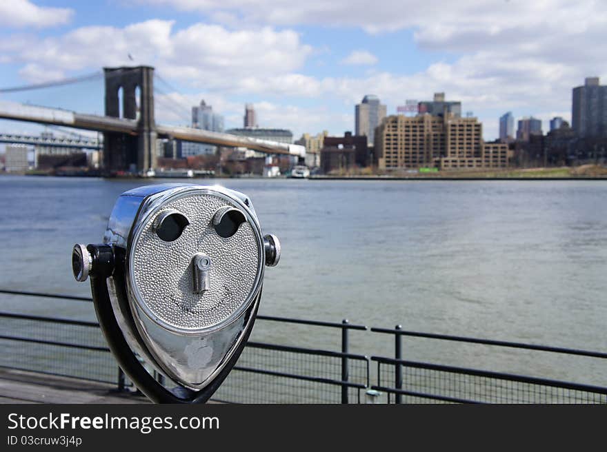 Viewer with happy face ready to scope Brooklyn from Manhattan side NYC. Viewer with happy face ready to scope Brooklyn from Manhattan side NYC