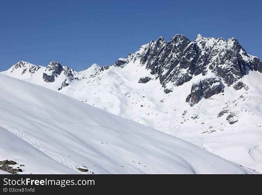 Rocky and snowy peaks in Alps mountains. Rocky and snowy peaks in Alps mountains