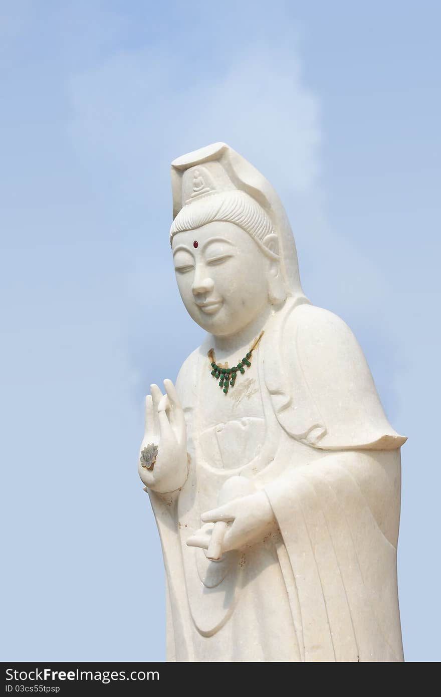 White of goddess of mercy (Kuan Yim) statue on coral island (Koh Larn). White of goddess of mercy (Kuan Yim) statue on coral island (Koh Larn).