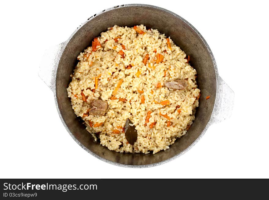 Pilaf in a cauldron isolated on a white background