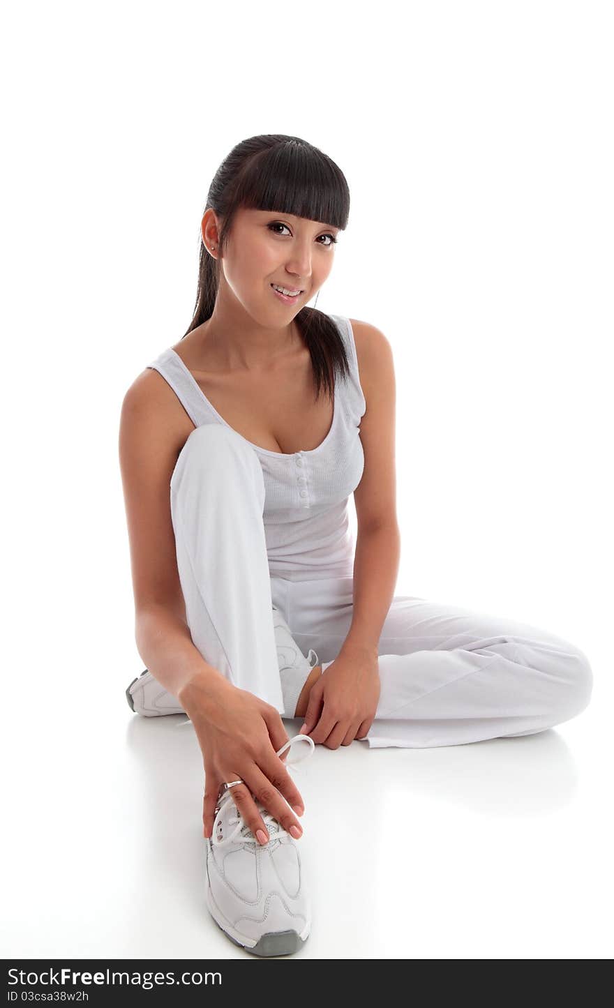 Beautiful smiling woman sitting on the floor