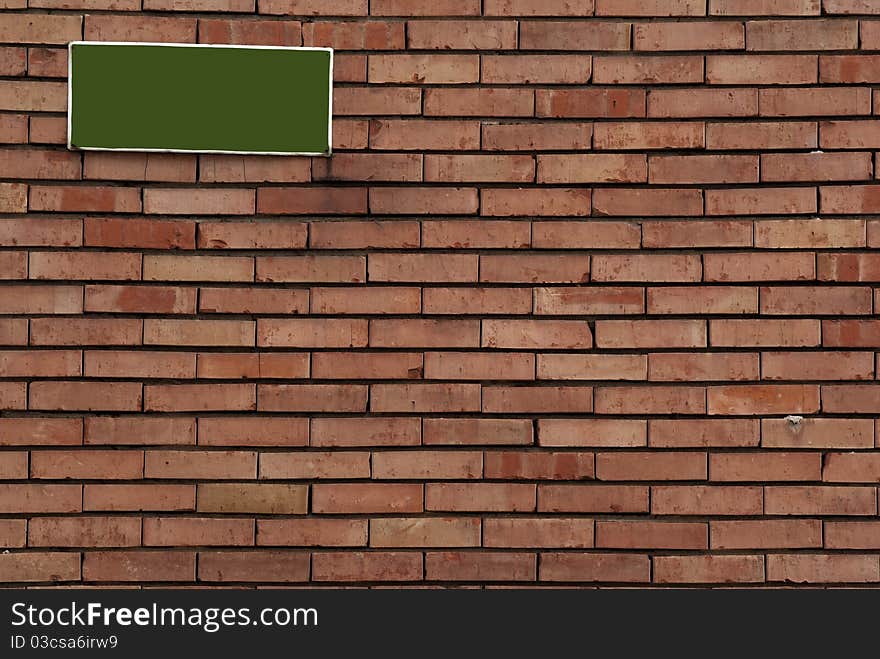 Brick Wall With Sign On It