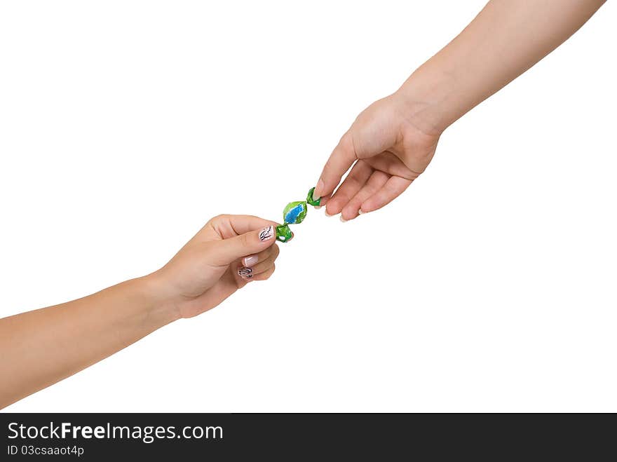 Two women hands with candy isolated on white background. Two women hands with candy isolated on white background