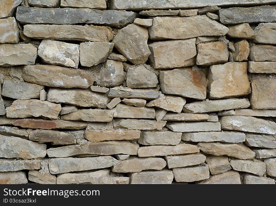 Old stone wall that can be used for background or texture. Old stone wall that can be used for background or texture