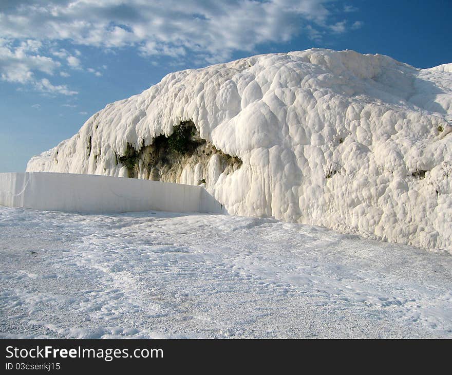 Pamukkale, a natural site in Turkey containing hot springs and travertines - terraces of carbonate minerals left by the flowing water