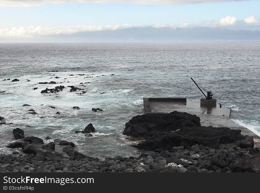 Small deserted quay in the coast of Pico island, Azores