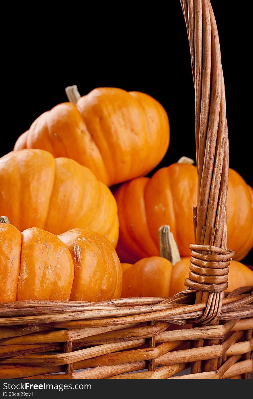 Small orange pumpkins symbolising autumn holidays and used in decorative works.