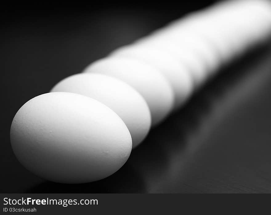 Bokeh displayed by a row of eggs. Bokeh displayed by a row of eggs