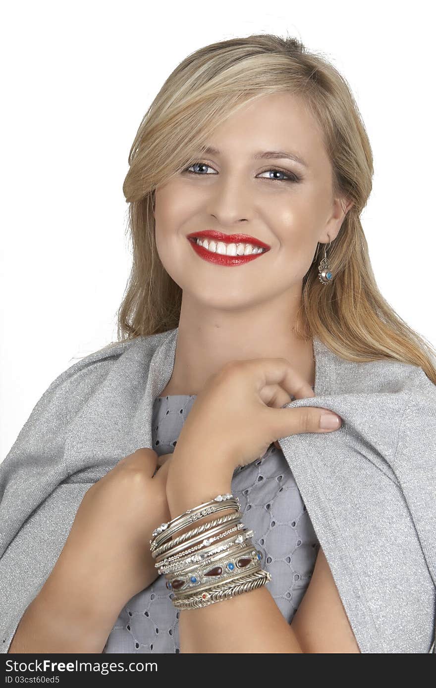 Portrait of a beautiful blonde woman with light blue eyes and classic make-up on white background. Portrait of a beautiful blonde woman with light blue eyes and classic make-up on white background