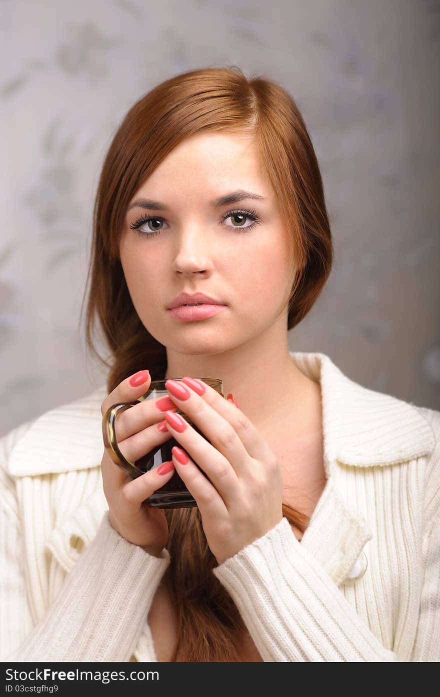 Young girl with a cup of tea at home. Young girl with a cup of tea at home