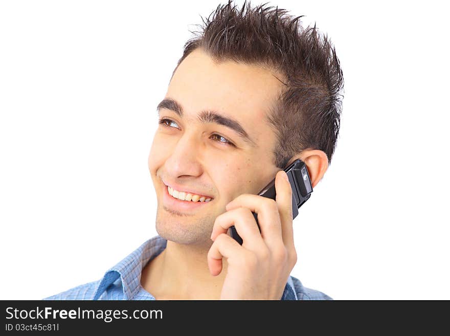 Closeup portrait of a happy young businessman talking on mobile phone