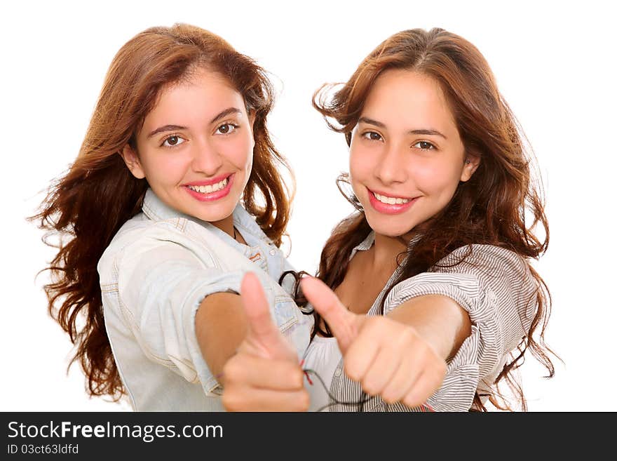 Two happy friends smiling at the camera with a gesture of ok on their hands