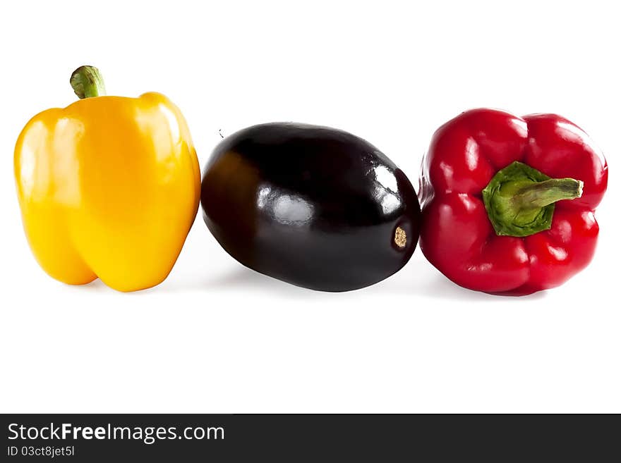 Yellow, red pepper and eggplant isolated on white background