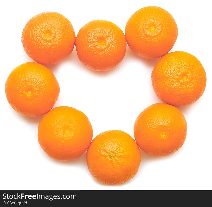 Heart shaped tangerins on a white background