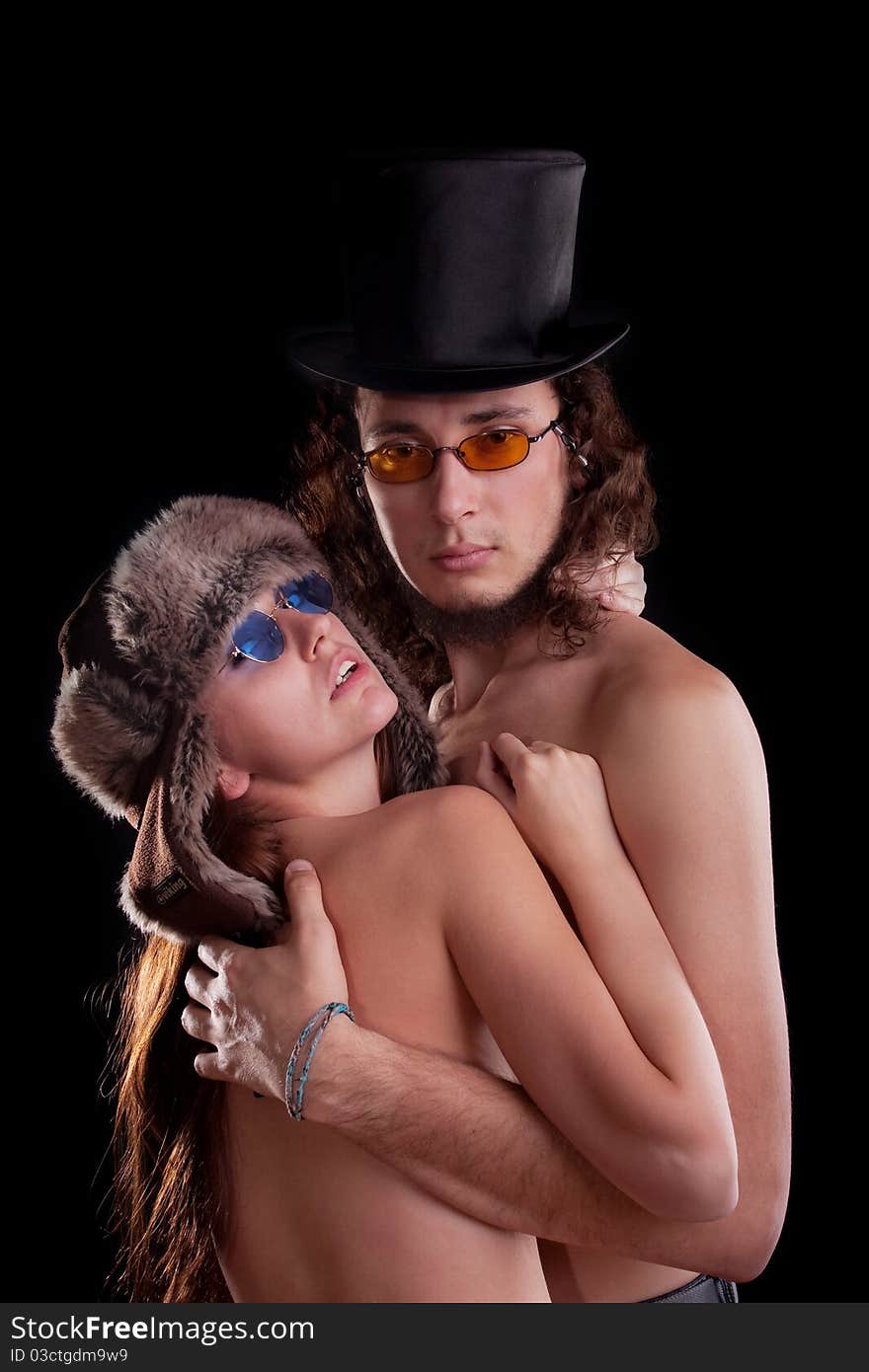 young couple. Posing in a studio. young couple. Posing in a studio