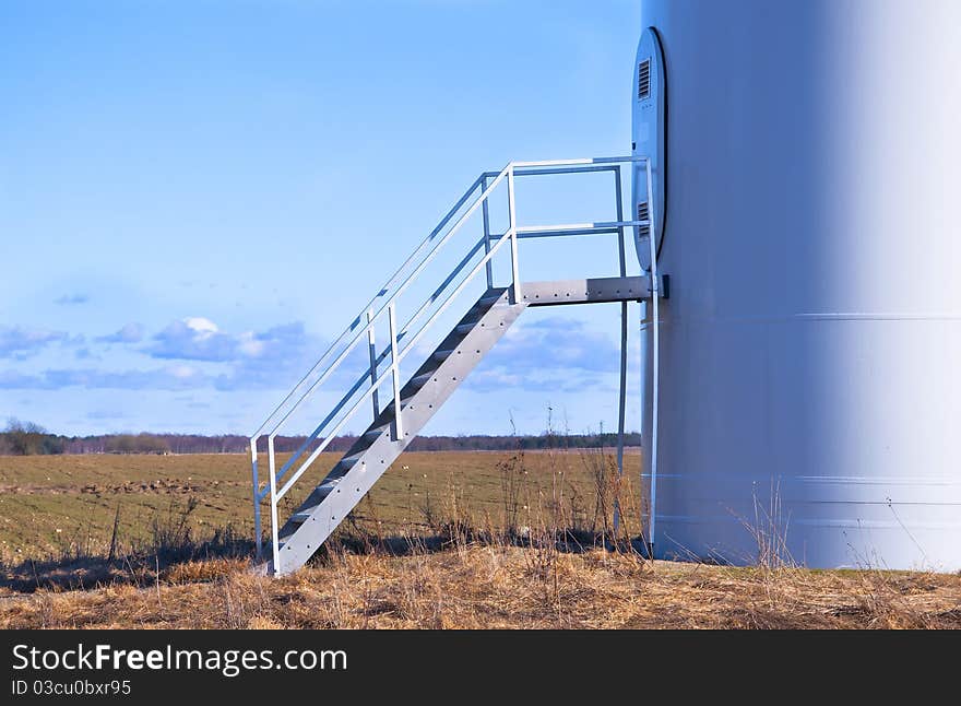 Wind turbine against blue sky