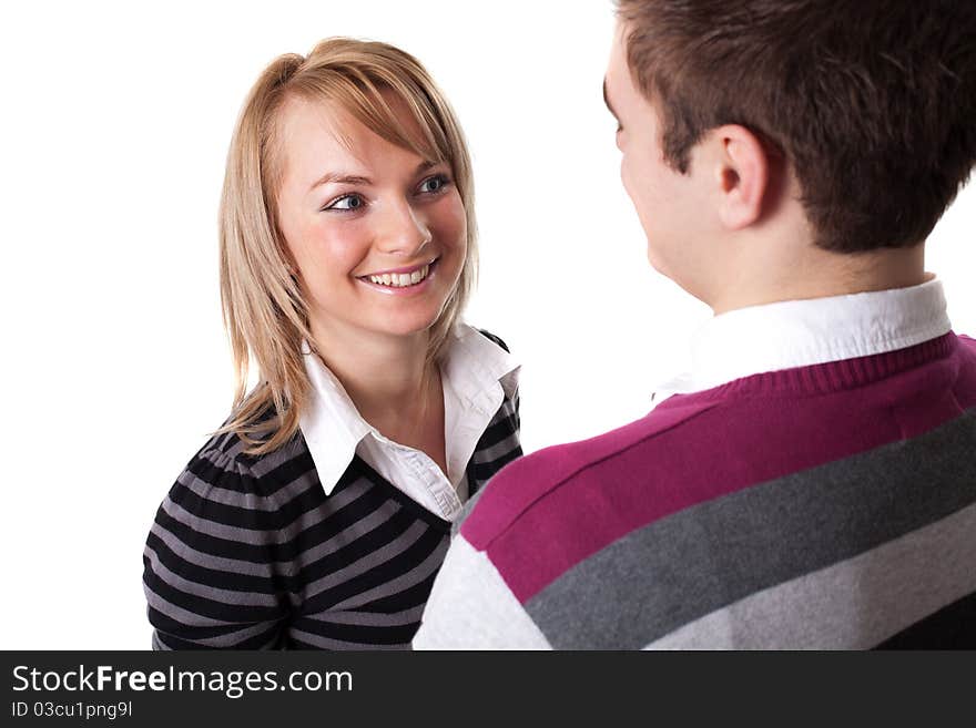 Portrait of a romantic young couple standing together over white background