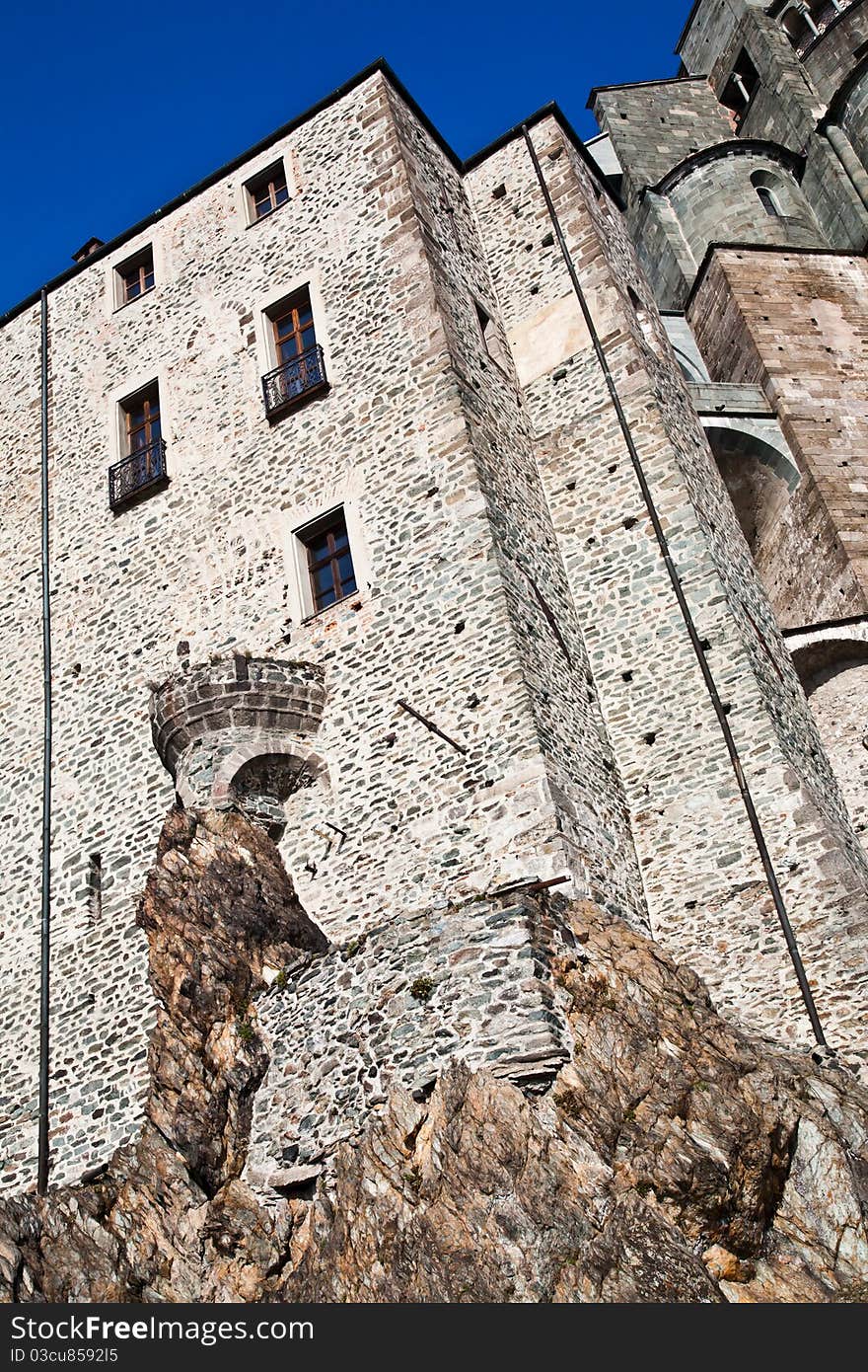 Abbey of 11st century, Piedmont region, Italy. The church, whose construction lasted for many years, is characterized by the unusual position and architecture. Abbey of 11st century, Piedmont region, Italy. The church, whose construction lasted for many years, is characterized by the unusual position and architecture.