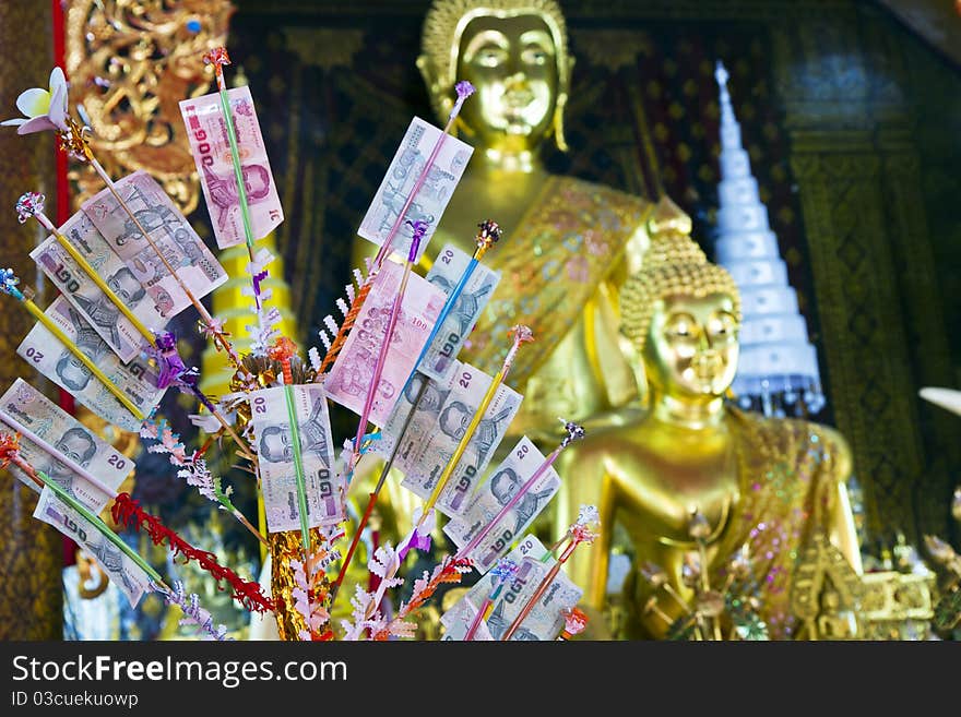 Money that people makes merit to give with Thai temple with the way takes the wood nips money ,. Money that people makes merit to give with Thai temple with the way takes the wood nips money ,