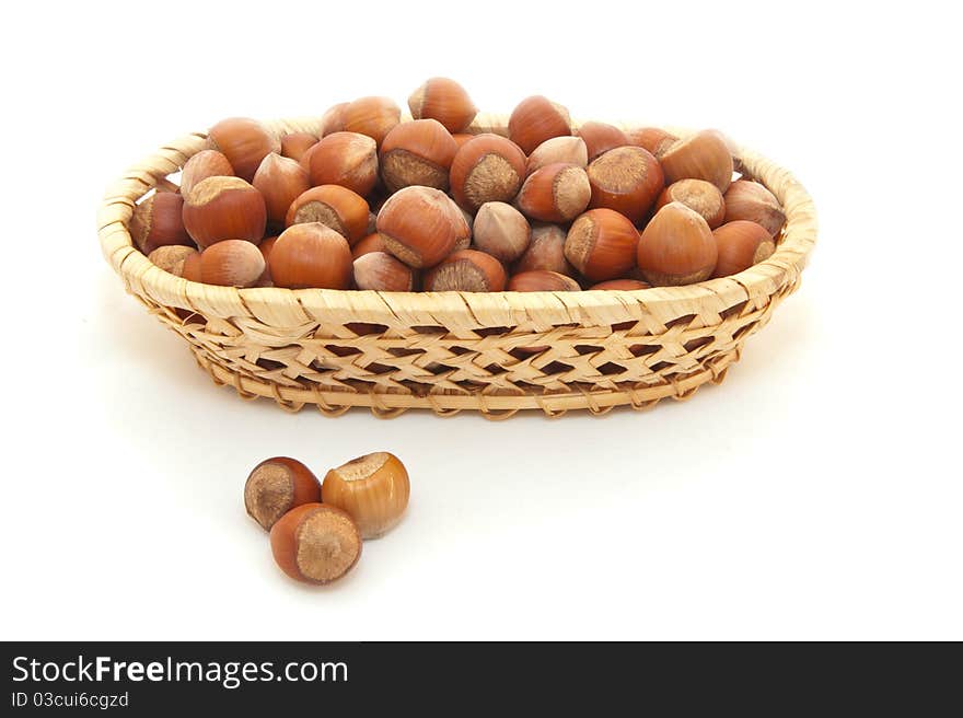 Filbert in a basket are isolated on a white background