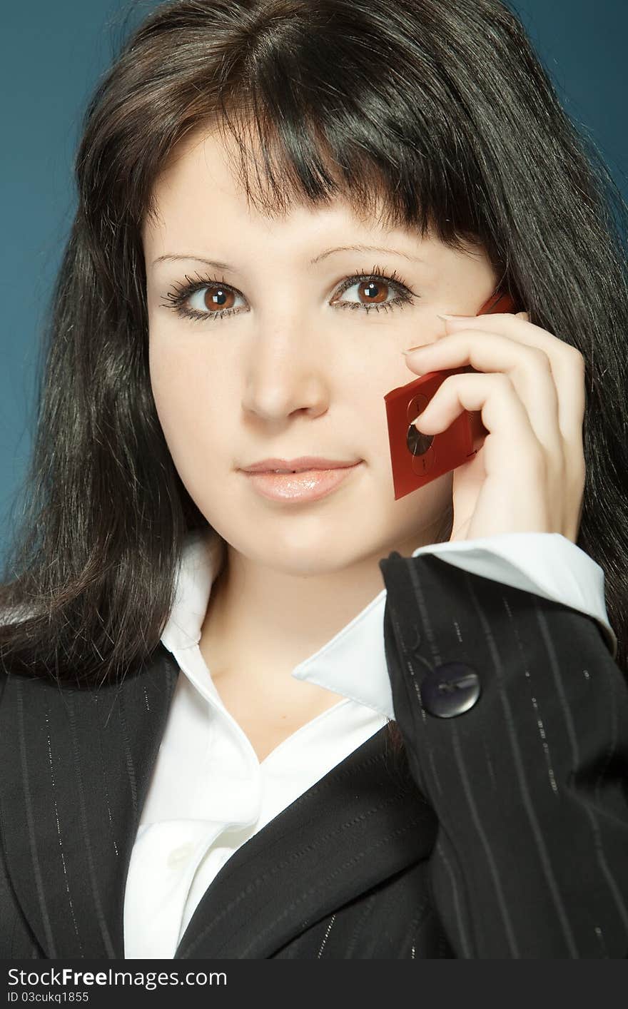 Close up of young woman talking on a mobile. Close up of young woman talking on a mobile