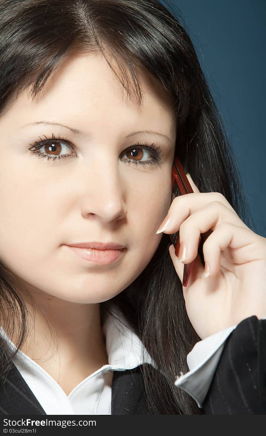 Close up of young woman talking on a mobile. Close up of young woman talking on a mobile