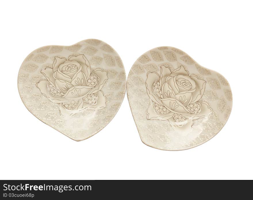 Two plate with roses on a white background