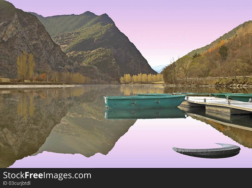 Boats on a lake in the north of Spain.