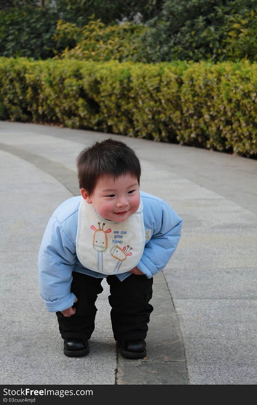 Lovely chinese boy in the garden