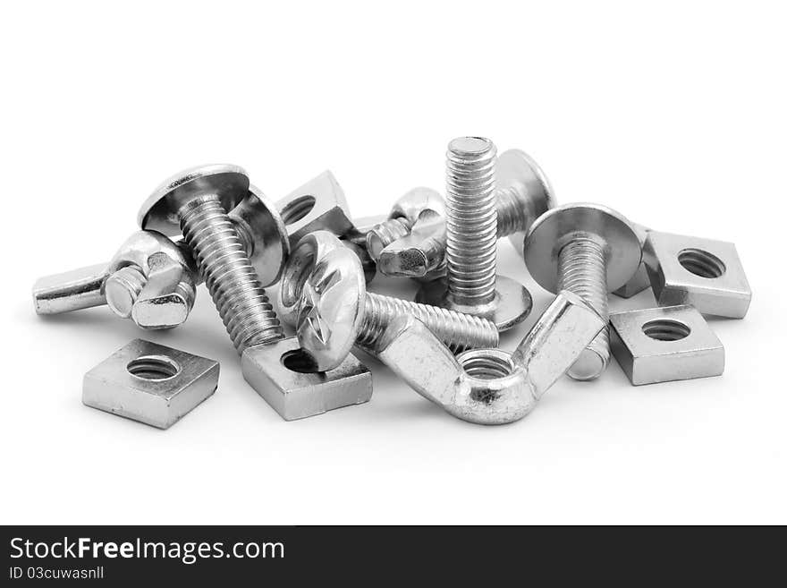 Pile of nuts and bolts over white