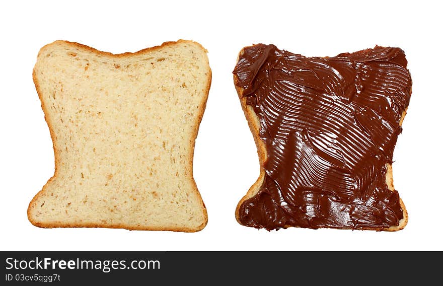 Two slices of bread one with milk chocolate on it isolated on a white background