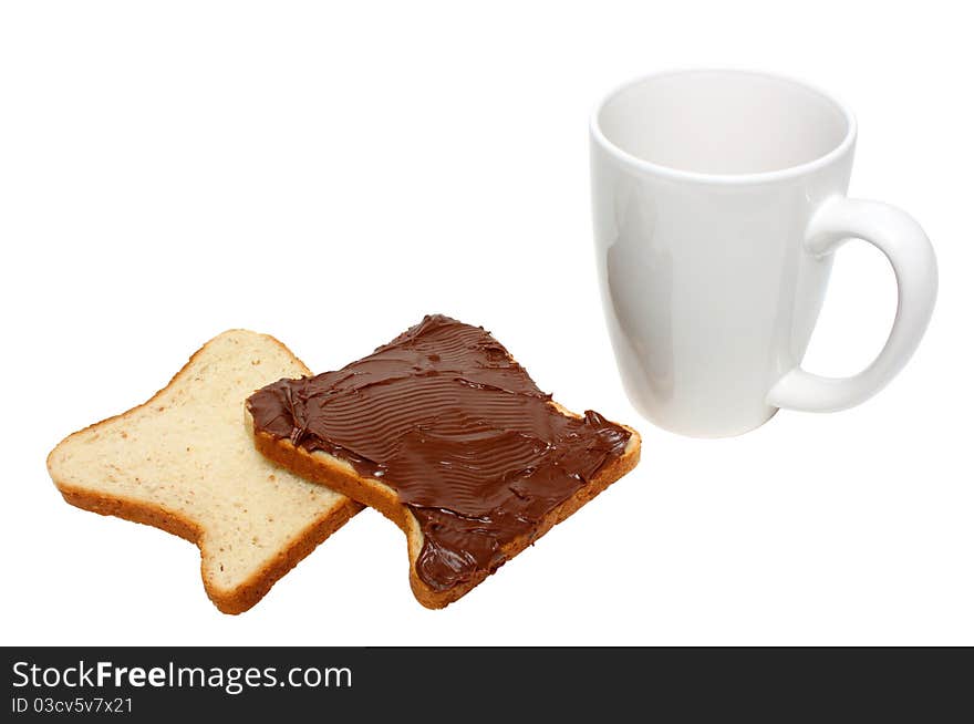 Slice of bread with chocolate cream and coffee mug isolated on a white background