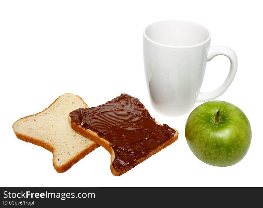 Slices of bread with chocolate cream on one of it, green apple and coffee mug isolated on a white background. Slices of bread with chocolate cream on one of it, green apple and coffee mug isolated on a white background