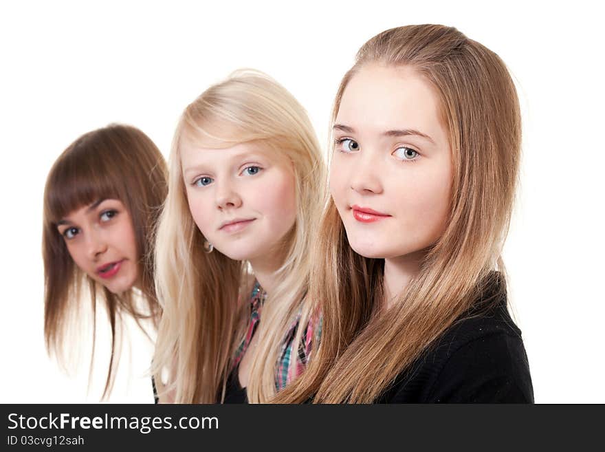 Portrait of three girls isolated on white background