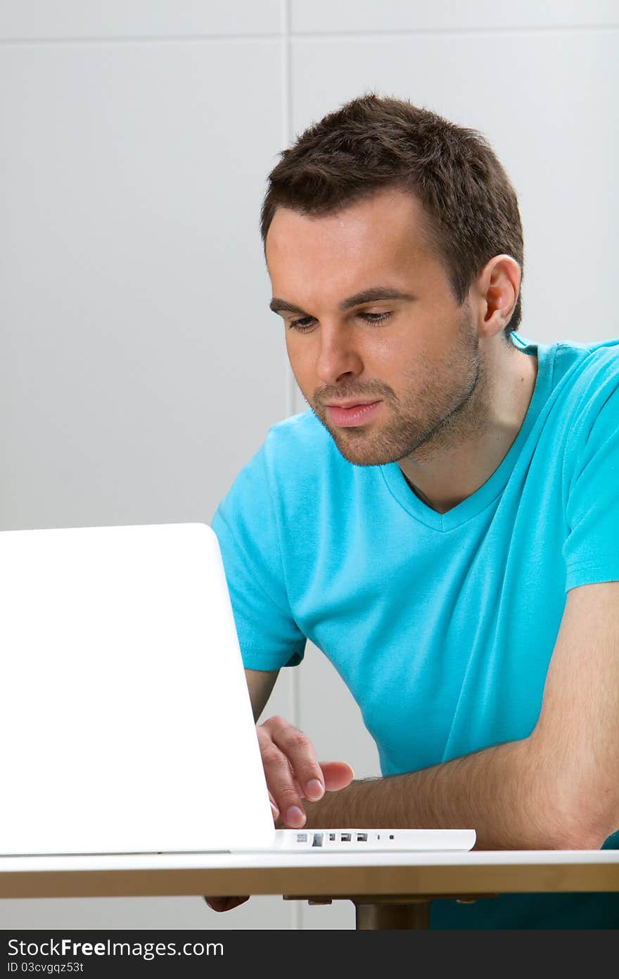 Young man using a laptop. Young man using a laptop