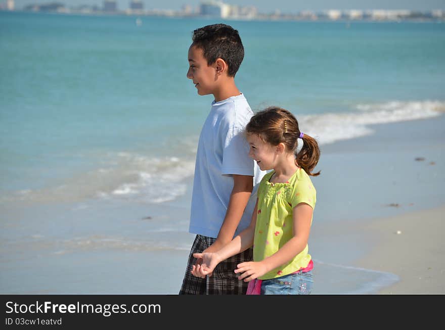 Brother and sister enjoying a day at the beach. Brother and sister enjoying a day at the beach