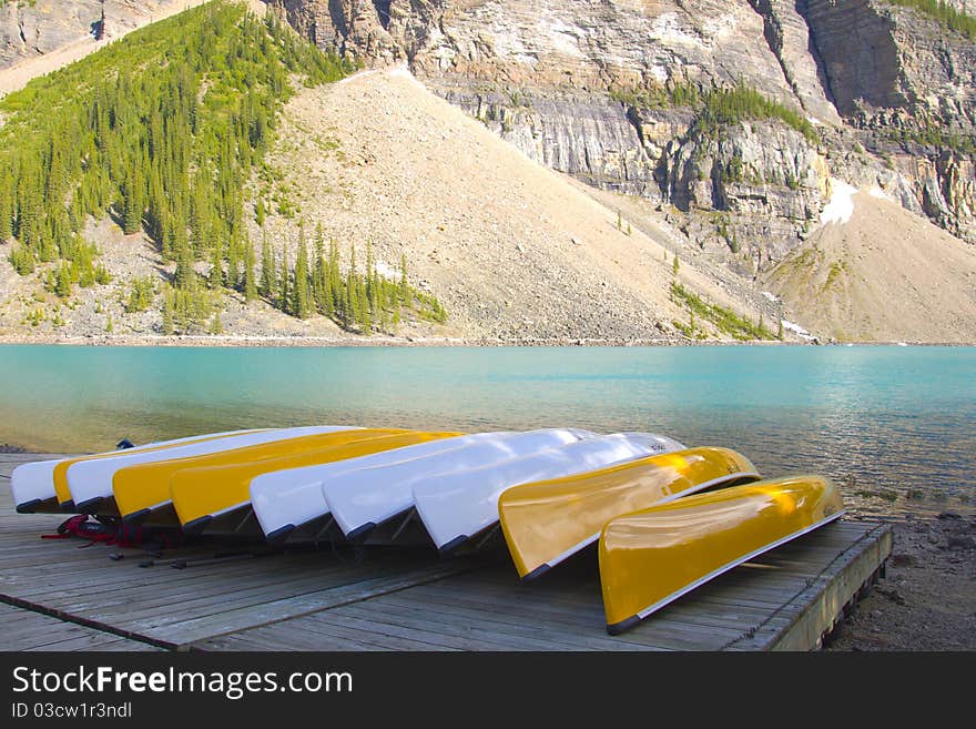 Canoes along the shore of Moraine Lake, Banff National Park, Alberta, Canada