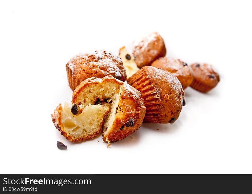 Sweet muffins sliced on white background. Sweet muffins sliced on white background