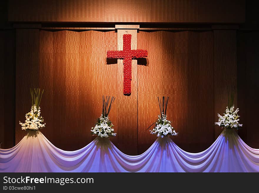 Red flower cross and curtain with white flowers. Red flower cross and curtain with white flowers