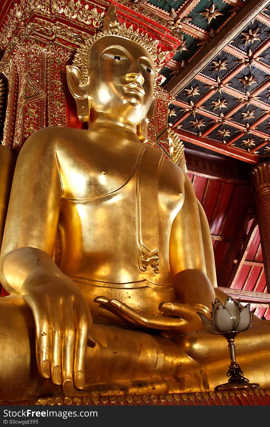 Giant golden Buddha statue in sitting position